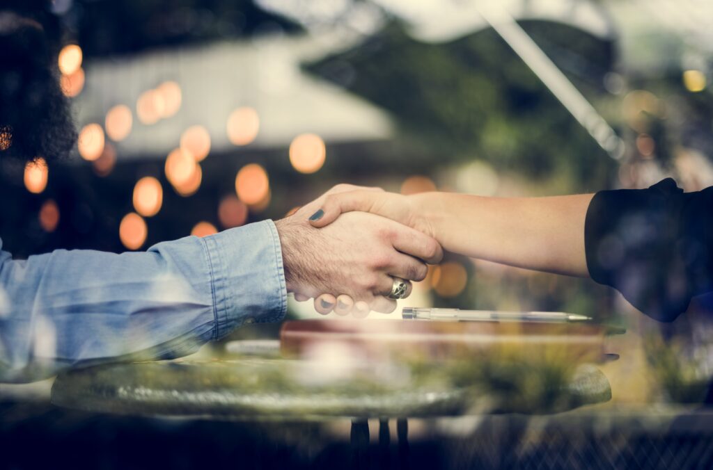 man and woman shaking hands