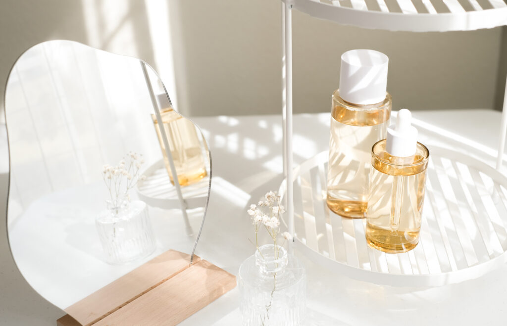 two scent bottles on a tray