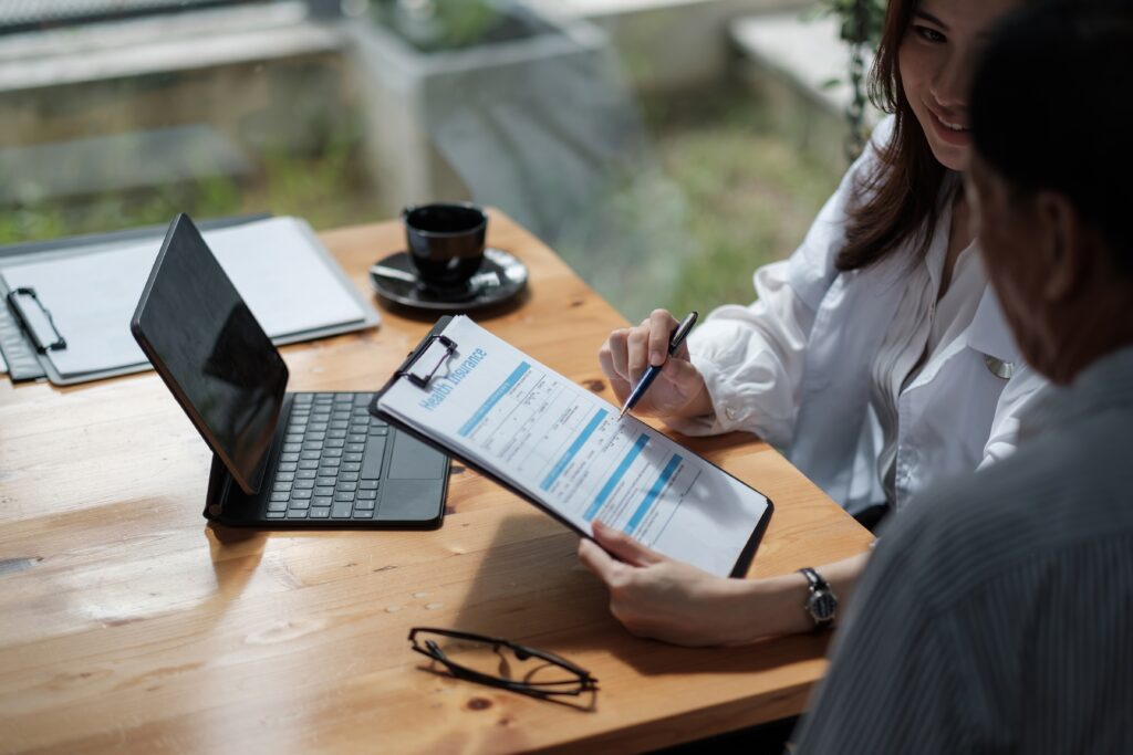 woman explaining health insurance form to a man