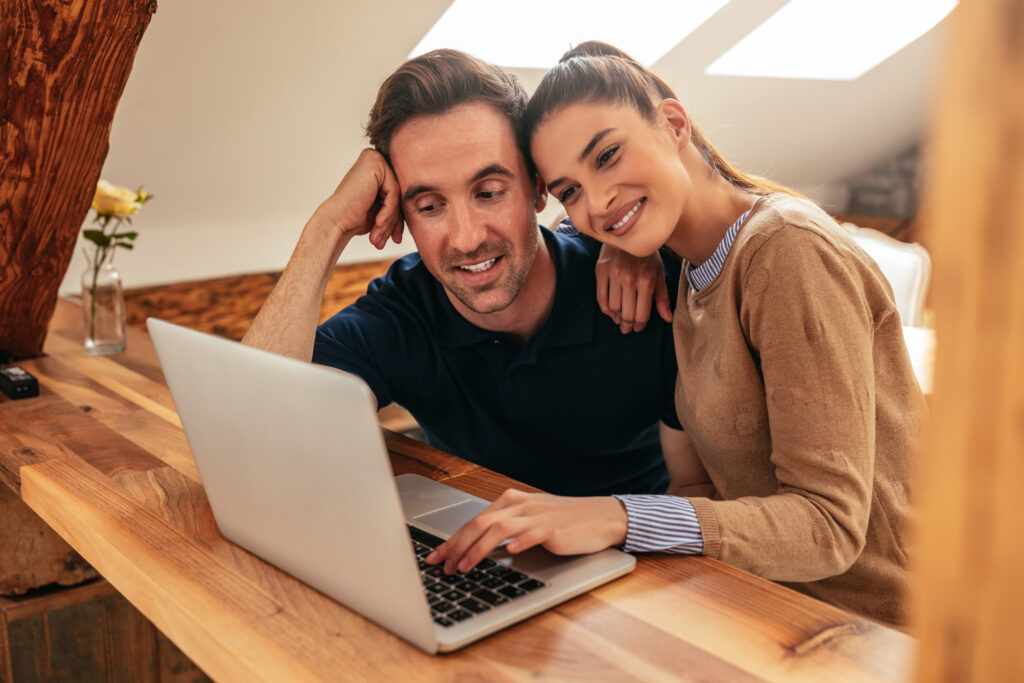 a couple using a laptop together