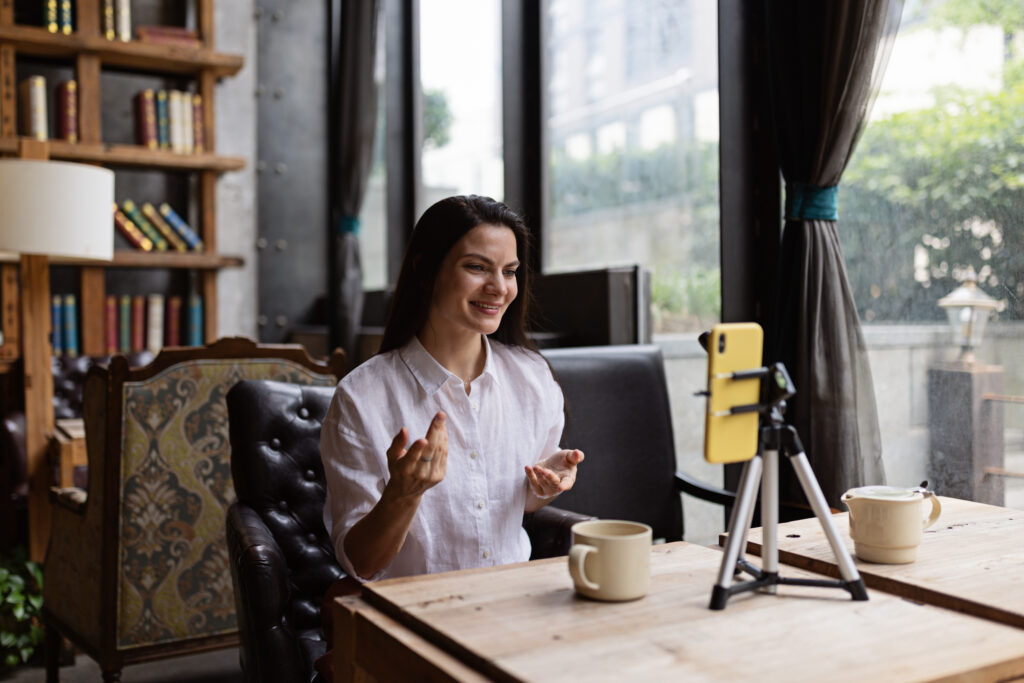 woman filming herself at a desk