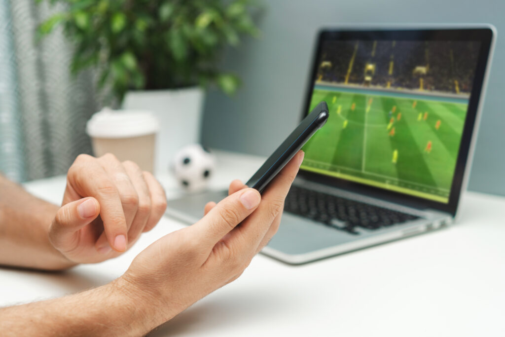 man betting on soccer game