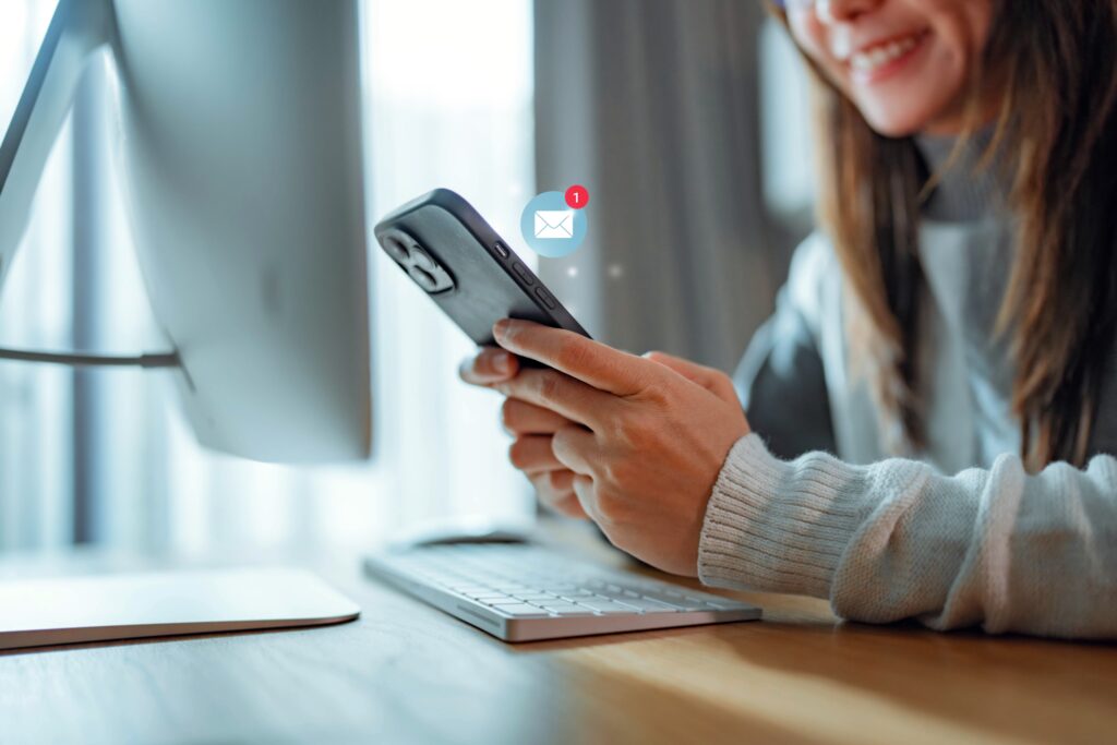 young woman receiving an email notification on her phone