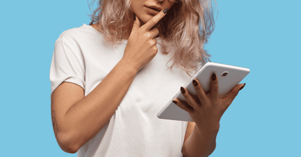 A thoughtful woman with a tablet, symbolizing the process of analyzing what works in other affiliate campaigns.